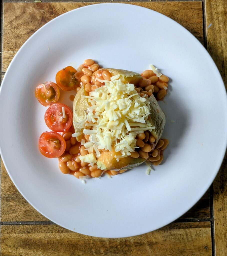 Cheap meals on a budget uk jacket potato with baked beans cheese and cherry tomatoes