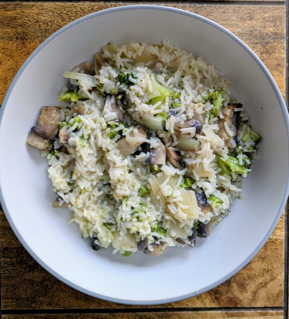 Cheap meals on a budget uk mushroom and broccoli risotto in a white bowl